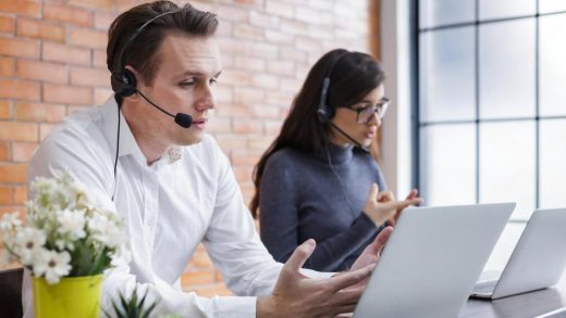 Customer service agents helping clients in a UAE office using queue and appointment systems